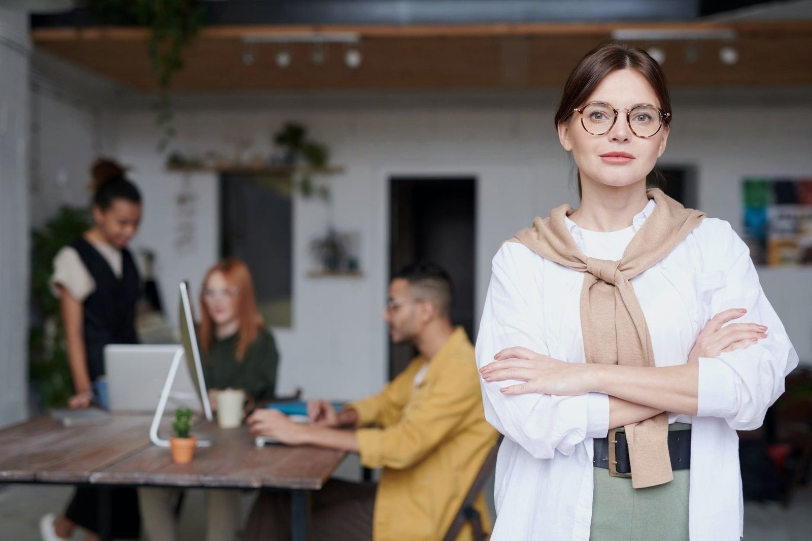 Business owner in her office with her team