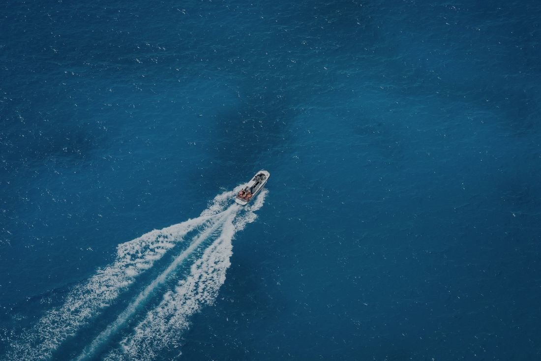 Aerial view of a speedboat on deep blue water